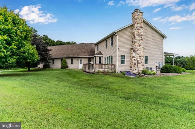 a view of a field with an ocean view