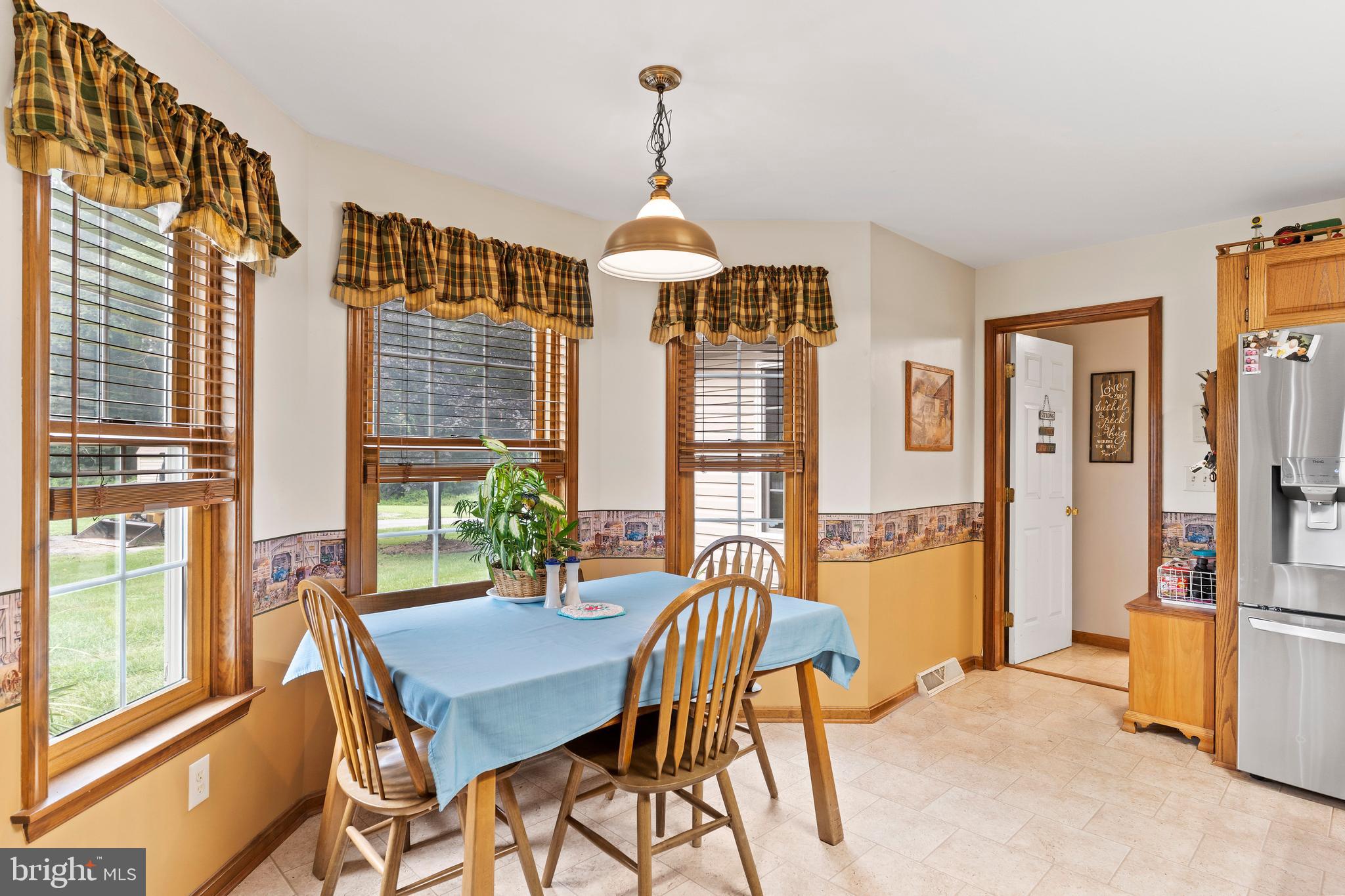 392 Peach Glen Road Gardners, PA 17324 - Photo 38 of 72 a dining room with furniture and a chandelier