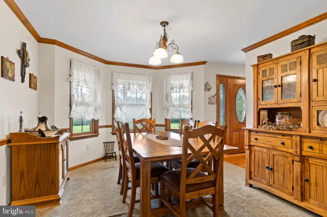 a bedroom with a bed and wooden furniture