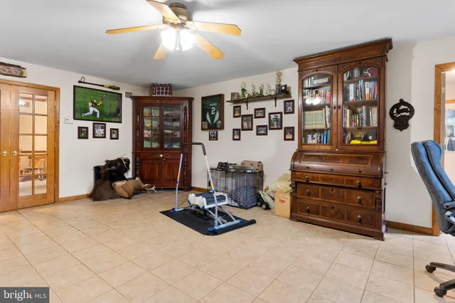 a bed room with a bed and a chair