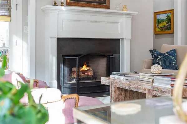 a view of a dinning table and chairs in patio of the house