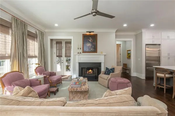 a spacious bedroom with a bed and a large window