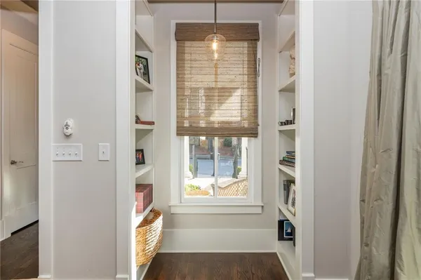a spacious bathroom with double sink a large mirror a toilet and bathtub