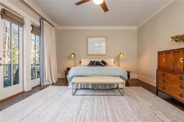 a bedroom with a bed rug and window