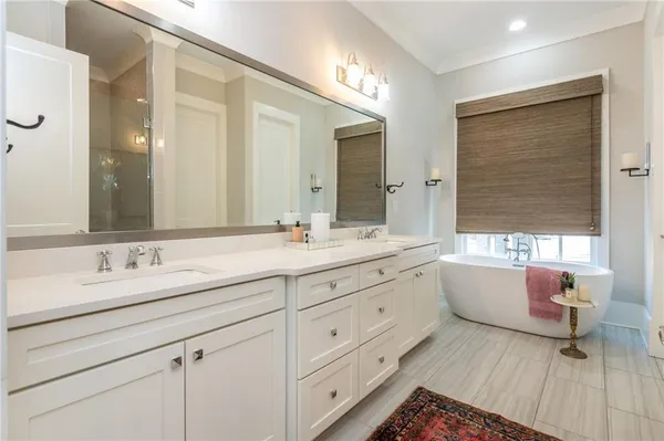 a bed room with a bed and a chair