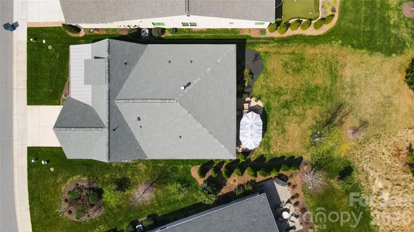 an aerial view of a house with a garden