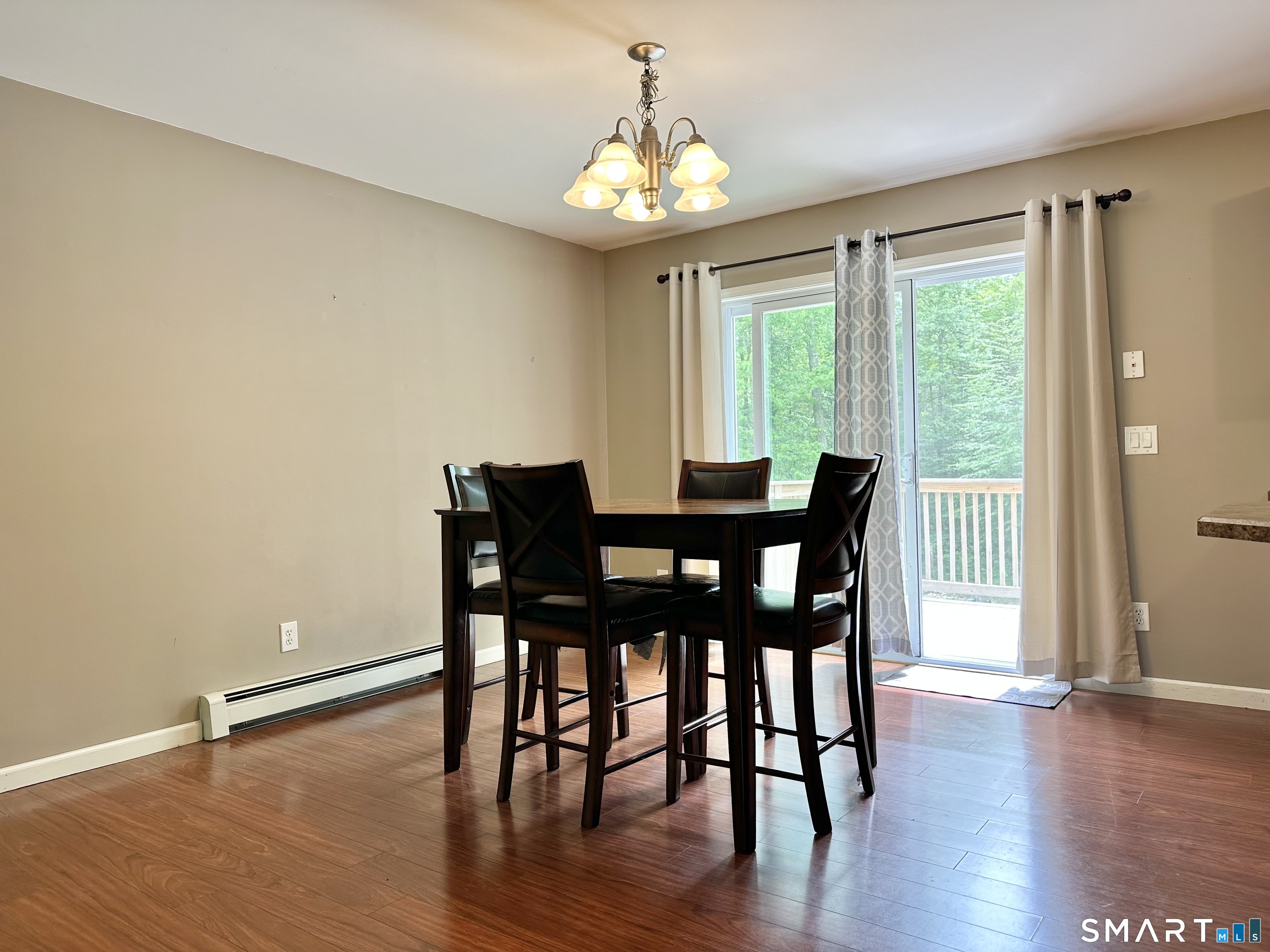 116 Tatnic Hill Road Brooklyn, CT 06234 - Photo 15 of 27 a dining room with furniture window wooden floor