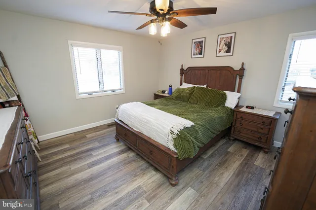 a bedroom with a bed and a dresser