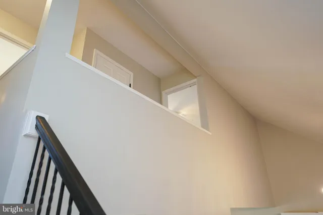 a bedroom with a bed and a table chair