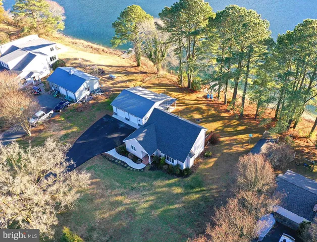a view of a lake with houses in the back