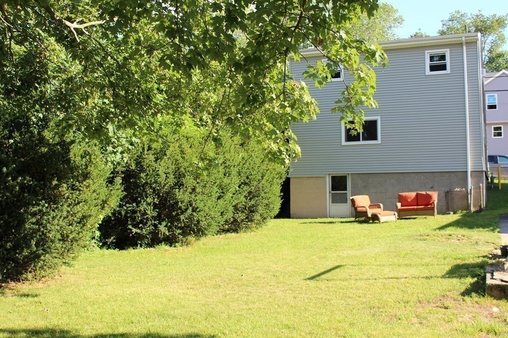 382 Tecumseh Street Fall River, MA 02721 - Photo 3 of 36 a view of a house with a yard