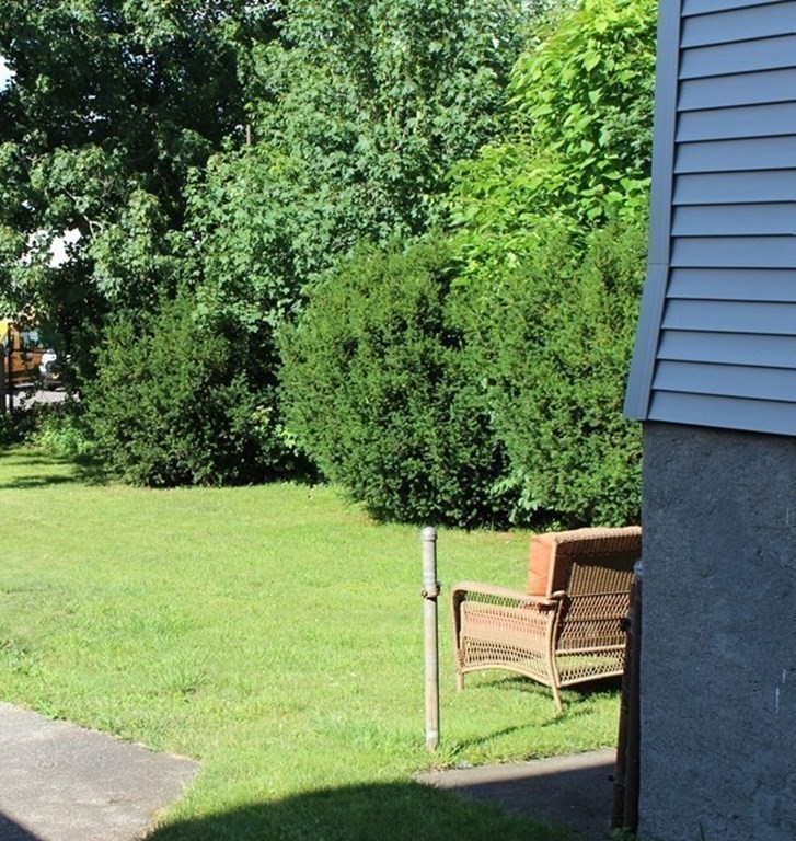 382 Tecumseh Street Fall River, MA 02721 - Photo 5 of 36 a house view with a garden space