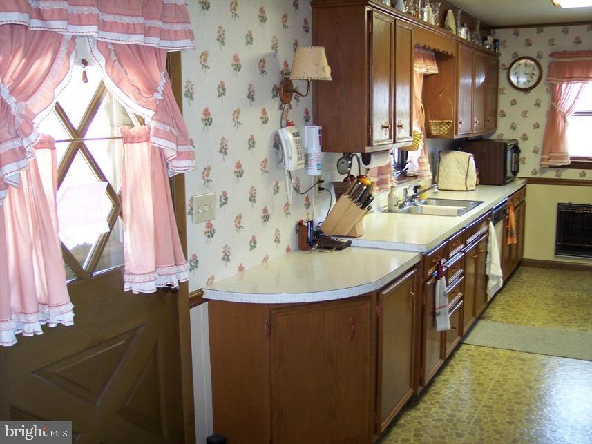 560 Blue Lake Road Denver, PA 17517 - Photo 12 of 27 a kitchen with a sink and a refrigerator