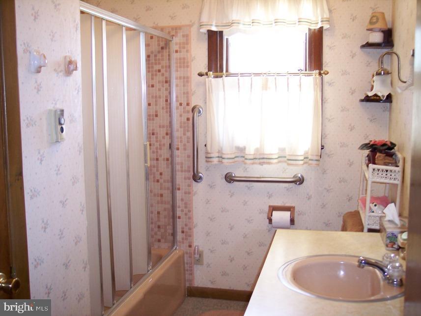 560 Blue Lake Road Denver, PA 17517 - Photo 15 of 27 a bathroom with a sink a toilet and shower curtain