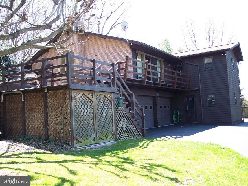 560 Blue Lake Road Denver, PA 17517 - Photo 16 of 27 a view of a house with a tub and wooden fence