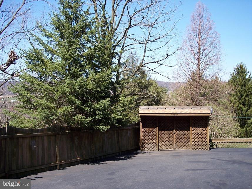 560 Blue Lake Road Denver, PA 17517 - Photo 25 of 27 a view of a barn in a yard with wooden fence