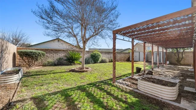 a view of a backyard with a patio
