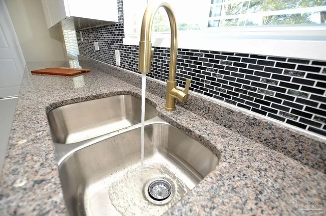 a view of wooden floor and chandelier in a room