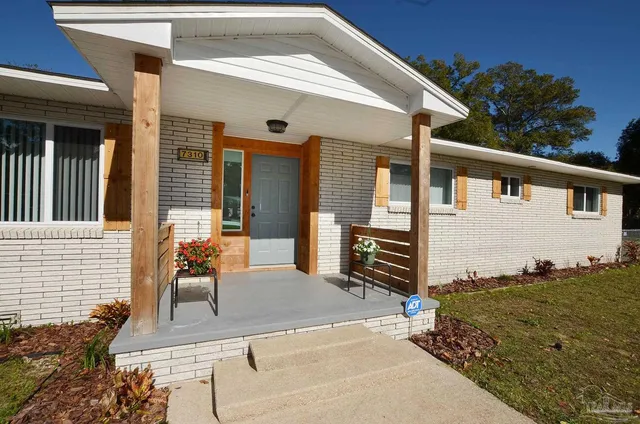a backyard of a house with seating space