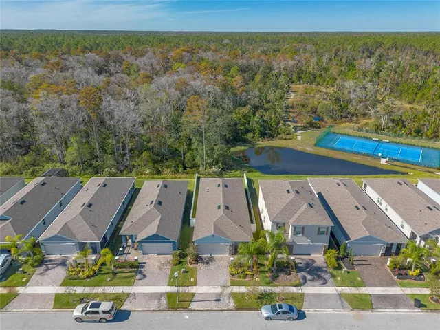 an aerial view of a city with ocean view