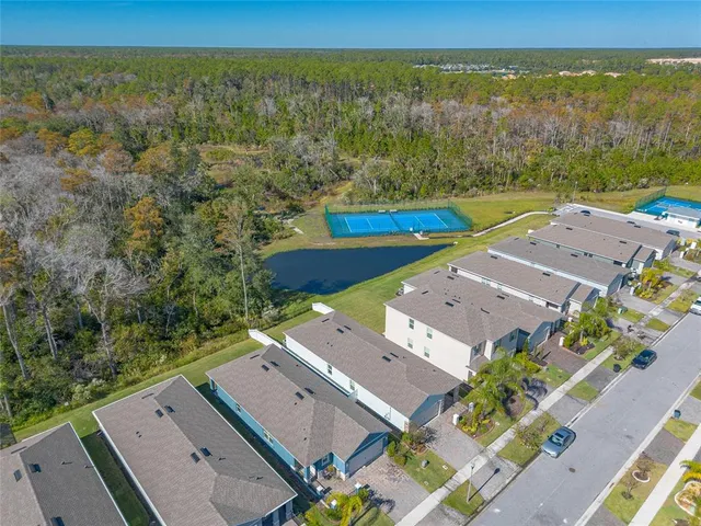 an aerial view of a city with ocean view
