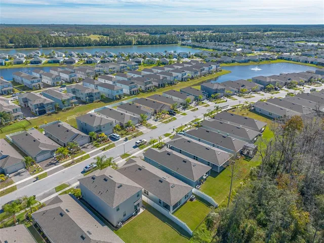 an aerial view of a house with a lake view