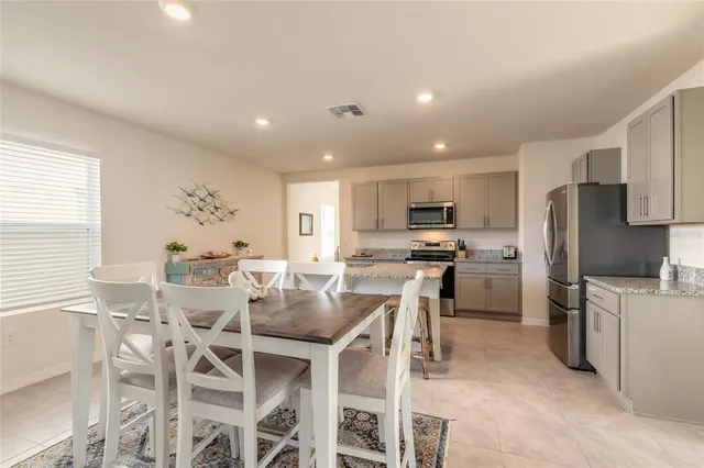 a view of a dining room with furniture
