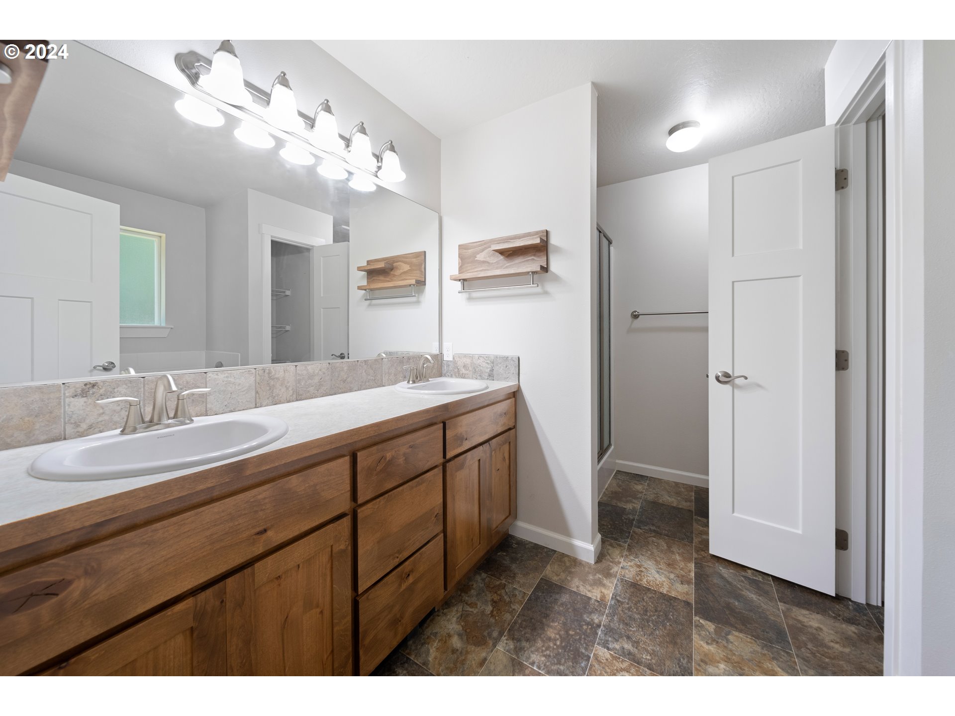 470 Providence Drive Reedsport, OR 97467 - Photo 15 of 41 a bathroom with a sink double vanity and a mirror