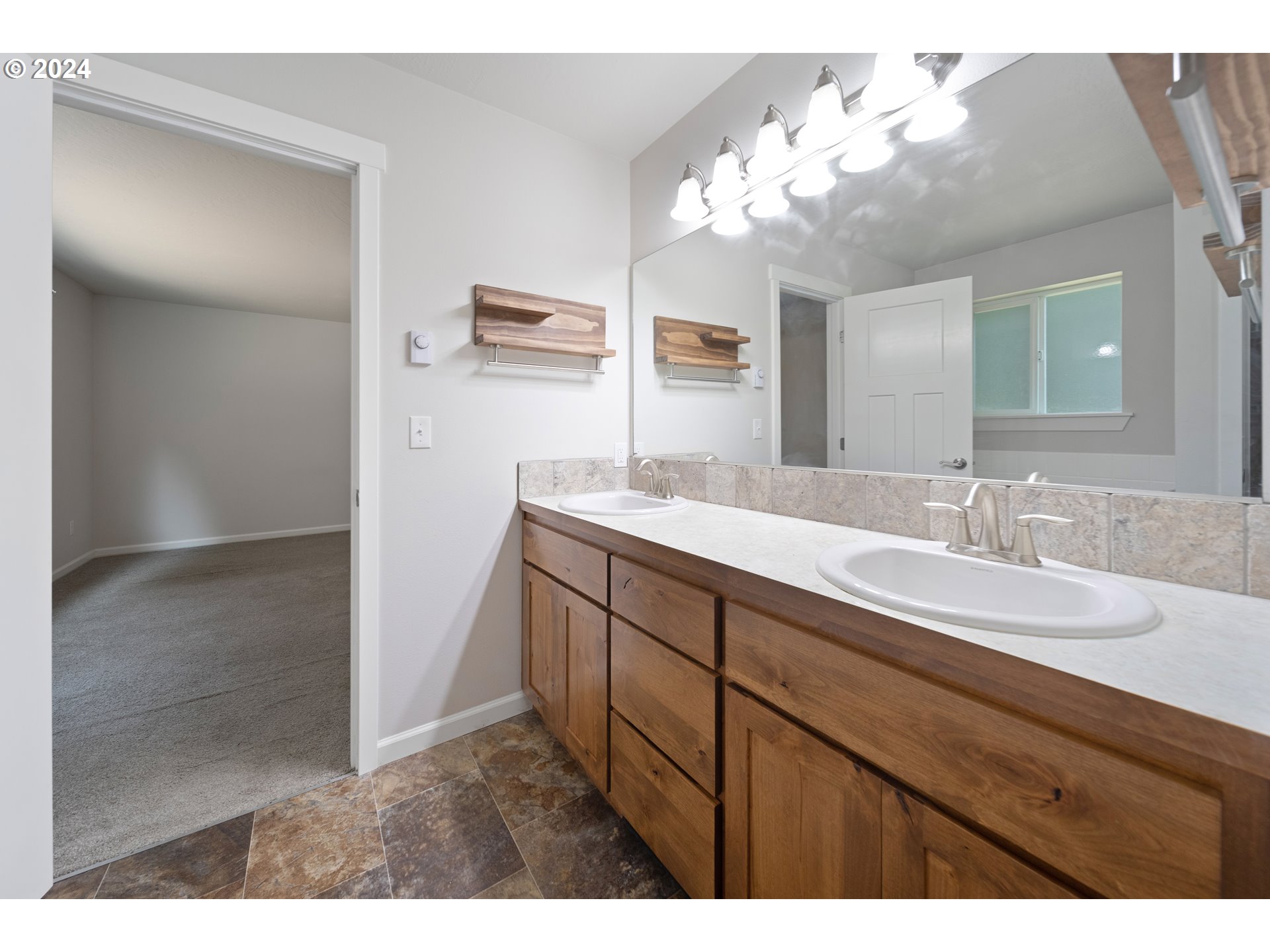 470 Providence Drive Reedsport, OR 97467 - Photo 16 of 41 a bathroom with a sink vanity and a mirror
