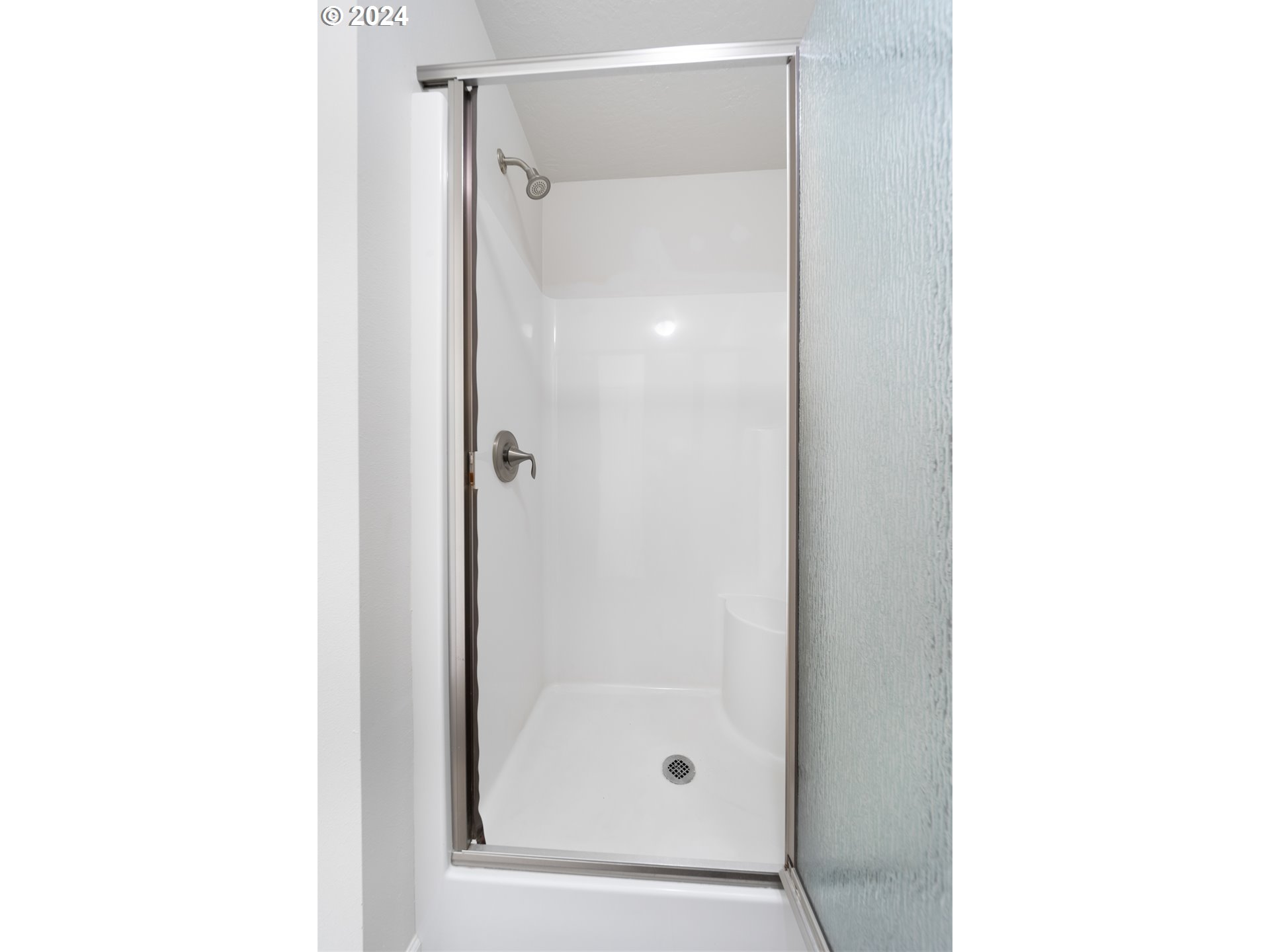 470 Providence Drive Reedsport, OR 97467 - Photo 18 of 41 a bathroom with a glass shower door