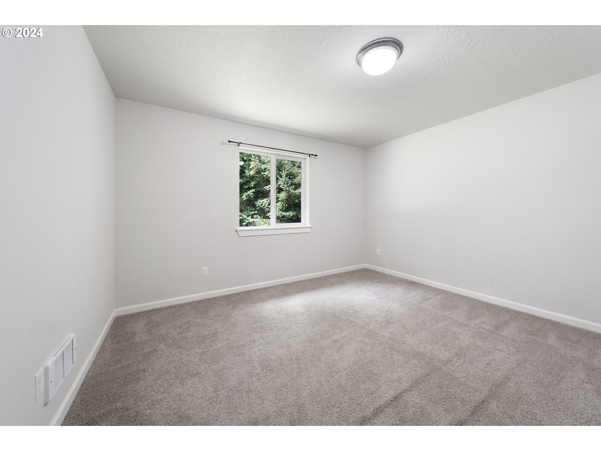 470 Providence Drive Reedsport, OR 97467 - Photo 22 of 41 a view of an empty room with a window