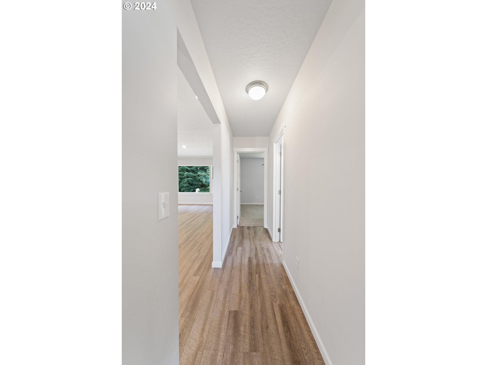 470 Providence Drive Reedsport, OR 97467 - Photo 24 of 41 a view of a hallway with wooden floor
