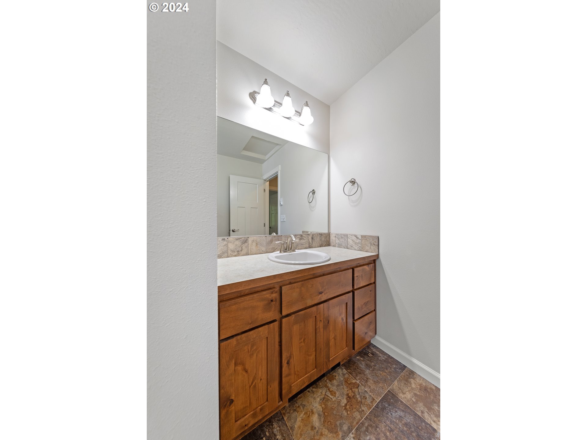 470 Providence Drive Reedsport, OR 97467 - Photo 27 of 41 a bathroom with a sink and a mirror