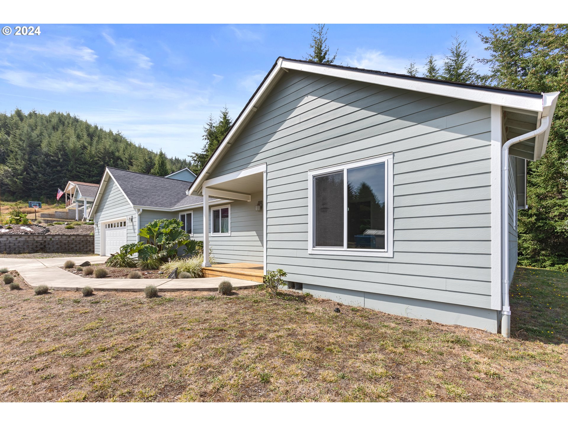 470 Providence Drive Reedsport, OR 97467 - Photo 3 of 41 a view of a house with a yard