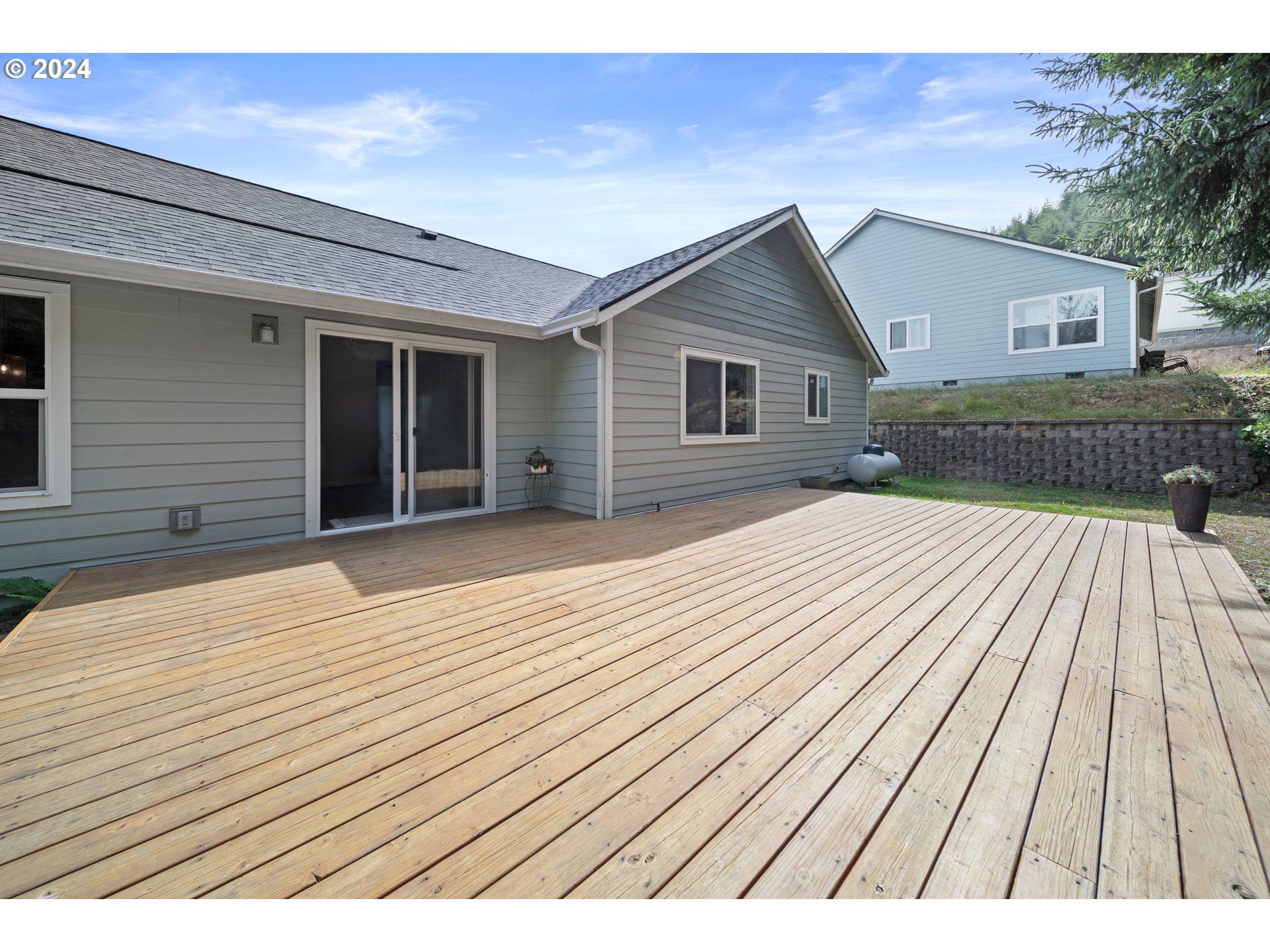 470 Providence Drive Reedsport, OR 97467 - Photo 36 of 41 a view of backyard with a wooden deck