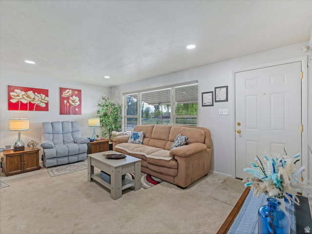 1502 North 475 West Sunset, UT 84015 - Photo 4 of 23 Living area featuring recessed lighting and wall-to-wall carpeting