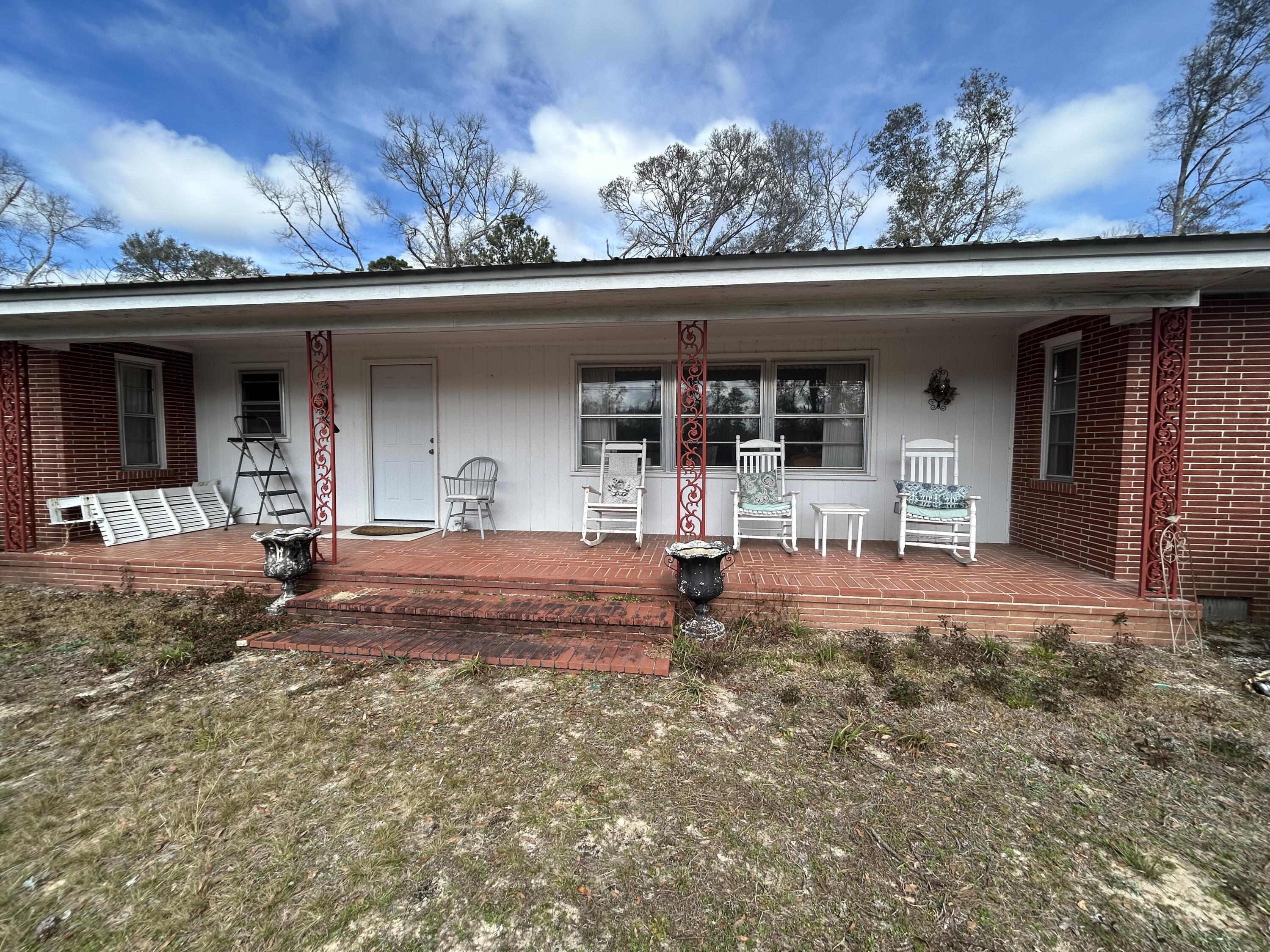 7151 Co Highway 280 DeFuniak Springs, FL 32435 - Photo 1 of 15 front view of a house with a porch
