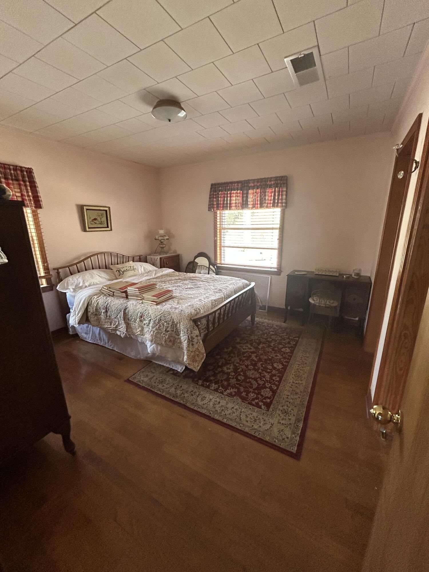 7151 Co Highway 280 DeFuniak Springs, FL 32435 - Photo 12 of 15 a bed sitting in a bedroom next to a window