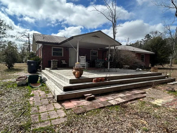 a view of a house with backyard porch and patio