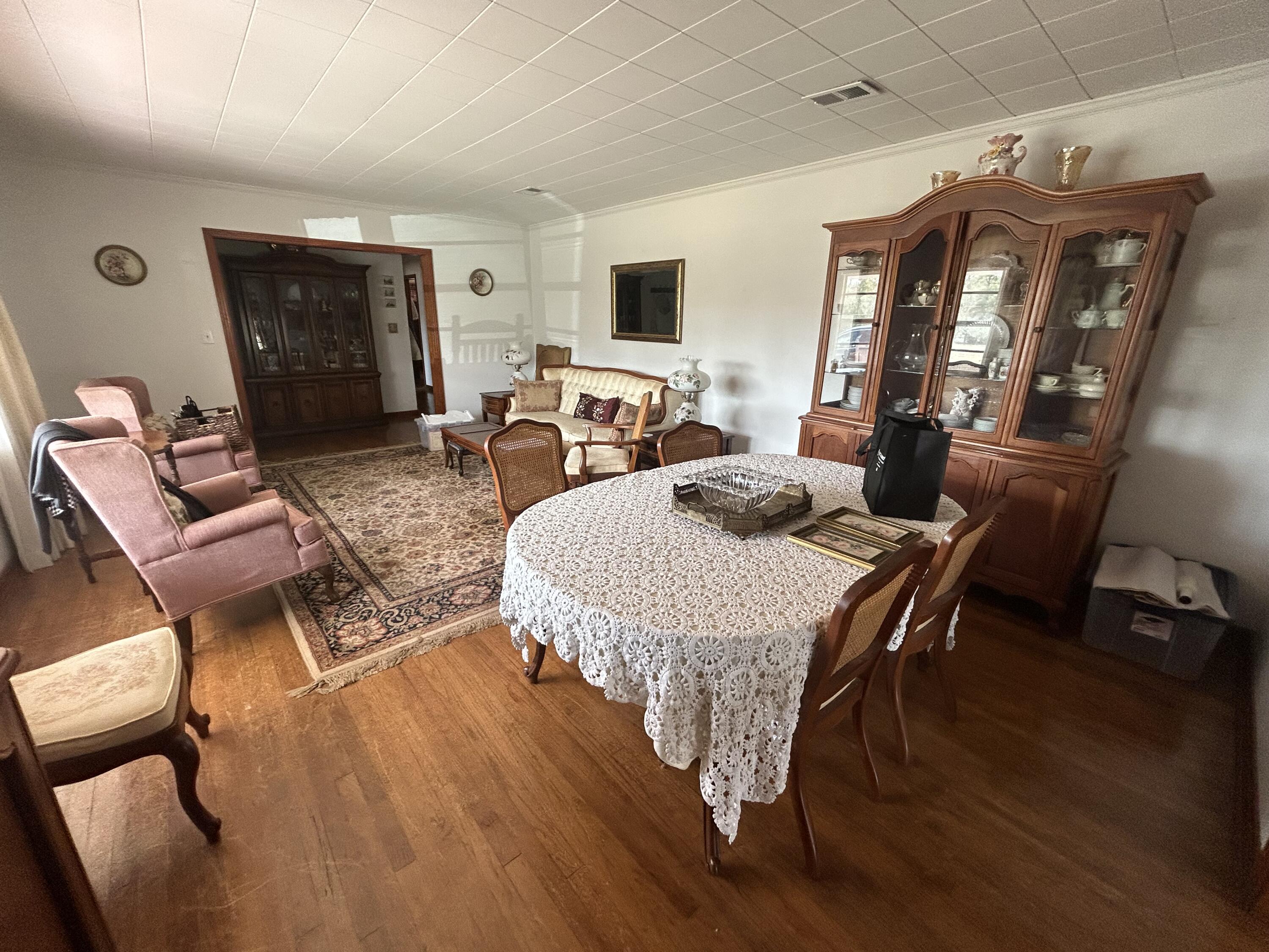 7151 Co Highway 280 DeFuniak Springs, FL 32435 - Photo 4 of 15 a living room with furniture a fireplace and a flat screen tv