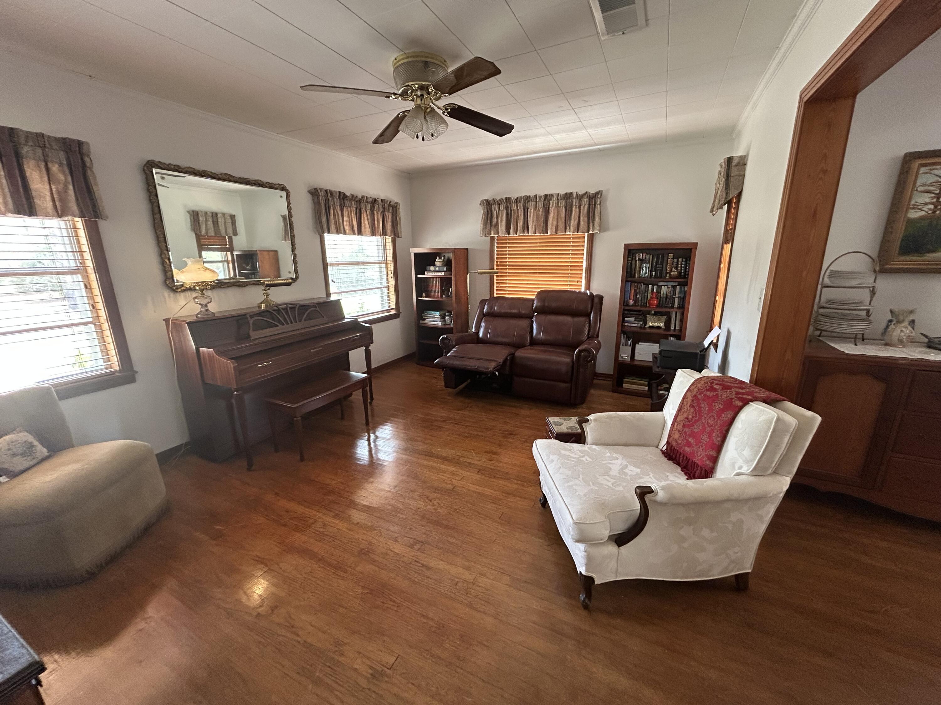 7151 Co Highway 280 DeFuniak Springs, FL 32435 - Photo 5 of 15 a living room with furniture fireplace and a window