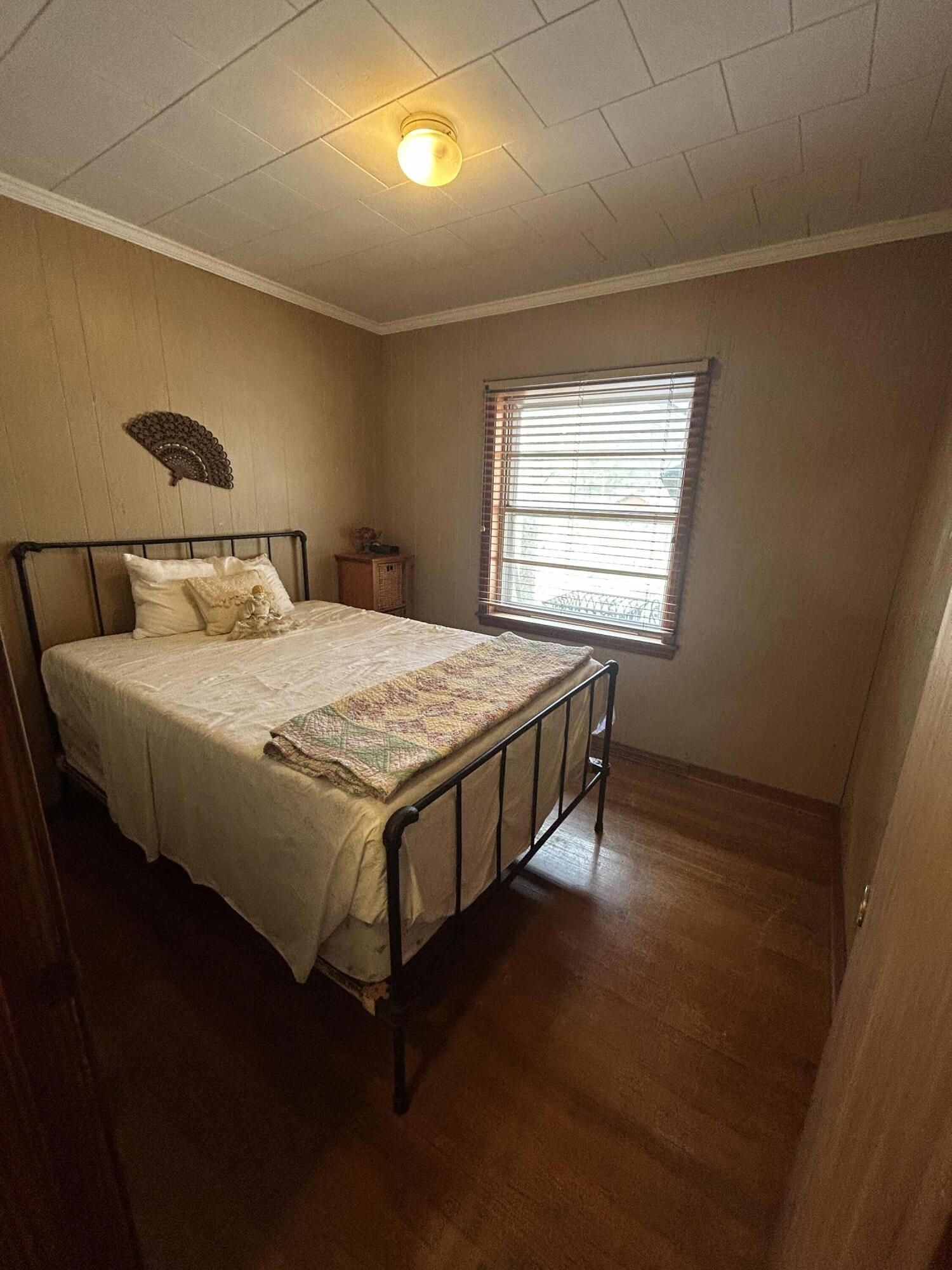 7151 Co Highway 280 DeFuniak Springs, FL 32435 - Photo 9 of 15 a bed sitting in a bedroom next to a window