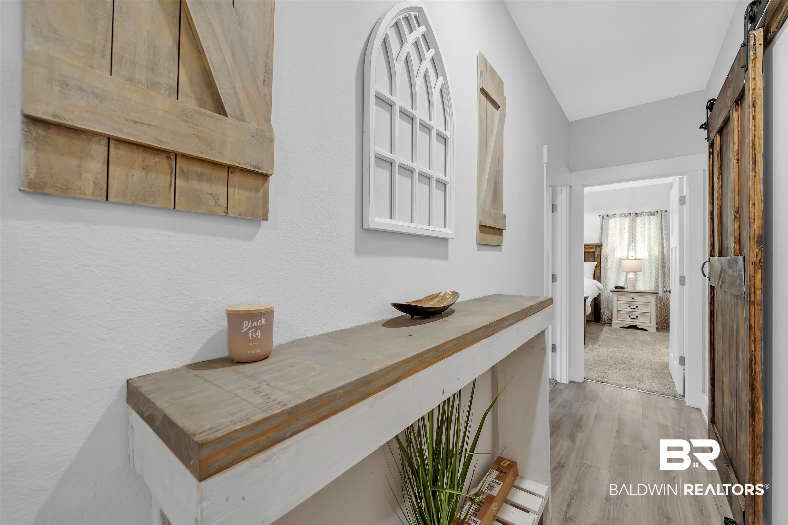16504 Prado Loop Loxley, AL 36551 - Photo 22 of 45 Corridor featuring a barn door and light wood-type flooring