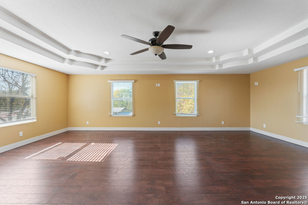 2930 Shane Road San Antonio, TX 78223 - Photo 18 of 75 a view of an empty room with wooden floor and a window