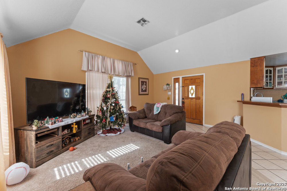 2930 Shane Road San Antonio, TX 78223 - Photo 21 of 75 a living room with furniture and a flat screen tv