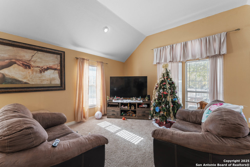 2930 Shane Road San Antonio, TX 78223 - Photo 22 of 75 a living room with furniture and a flat screen tv