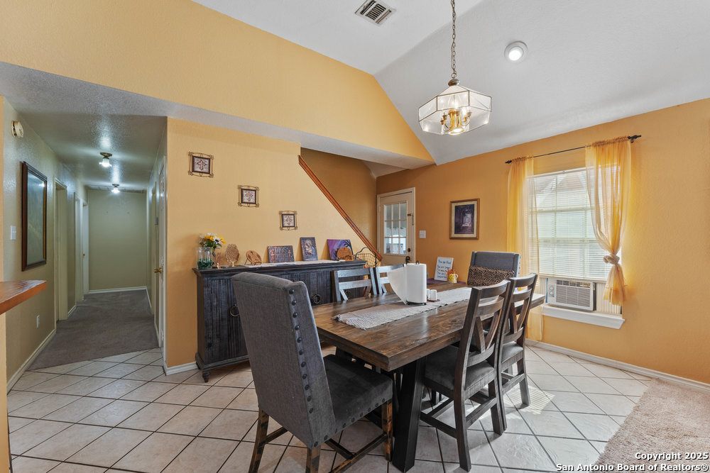 2930 Shane Road San Antonio, TX 78223 - Photo 24 of 75 a view of a dining room with furniture window and wooden floor