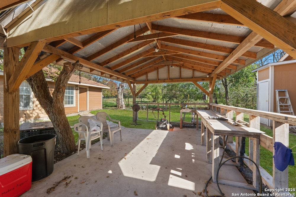 2930 Shane Road San Antonio, TX 78223 - Photo 35 of 75 a patio with yard glass top table and chairs