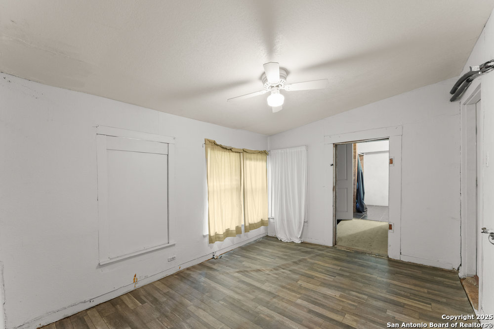 2930 Shane Road San Antonio, TX 78223 - Photo 40 of 75 an empty room with wooden floor and ceiling fan
