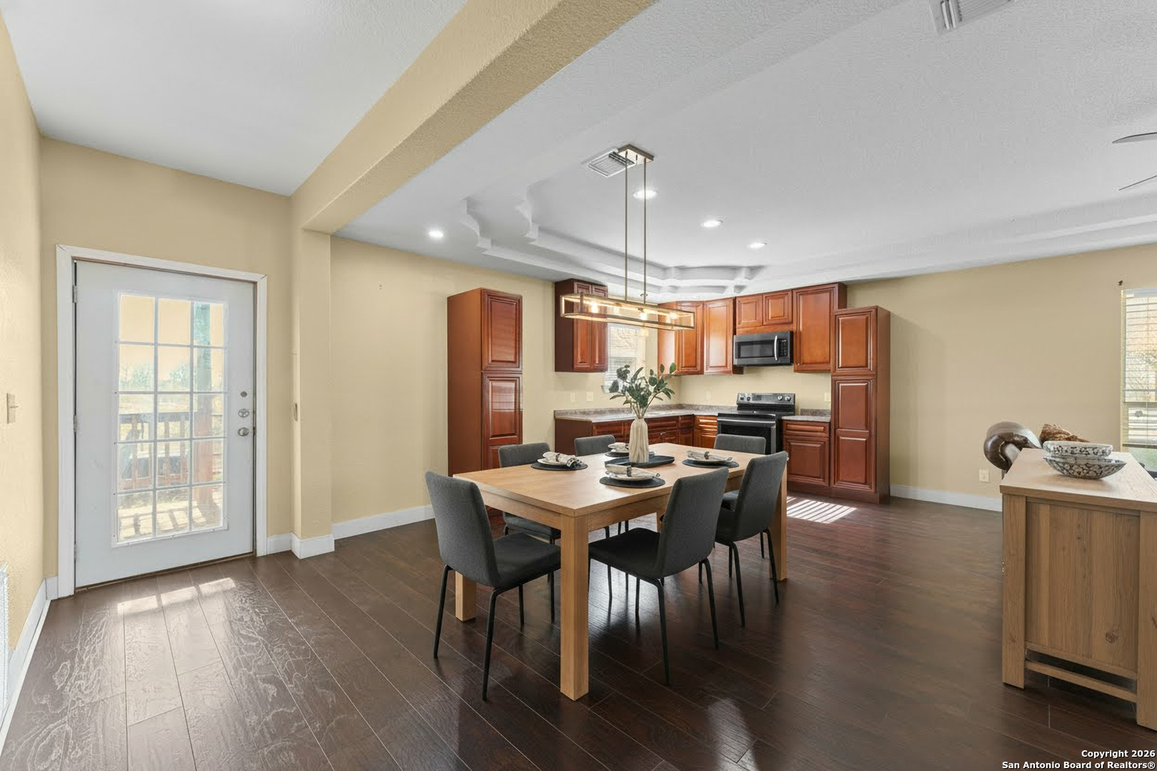 2930 Shane Road San Antonio, TX 78223 - Photo 4 of 75 a view of a dining room with furniture and wooden floor